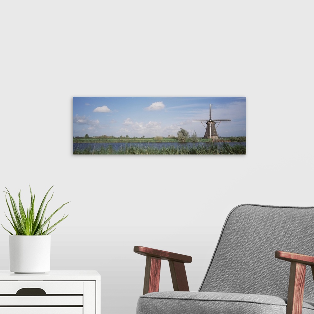 A modern room featuring Netherlands, Traditional windmill in the village