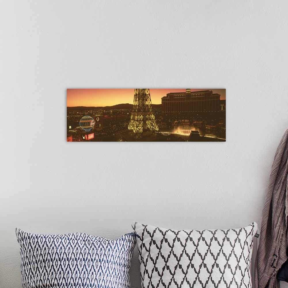 A bohemian room featuring Panoramic photograph from a high angle of Las Vegas at night, including Paris, the Eiffel Tower a...