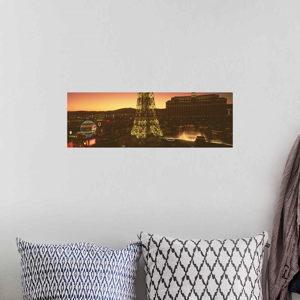 A bohemian room featuring Panoramic photograph from a high angle of Las Vegas at night, including Paris, the Eiffel Tower a...