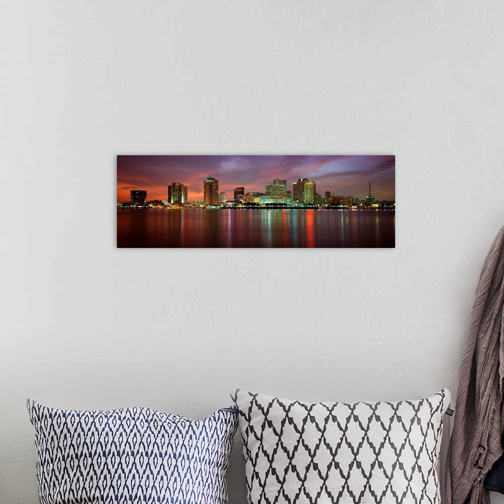 A bohemian room featuring Panoramic photograph of the Crescent City skyline at twilight reflecting in the water.