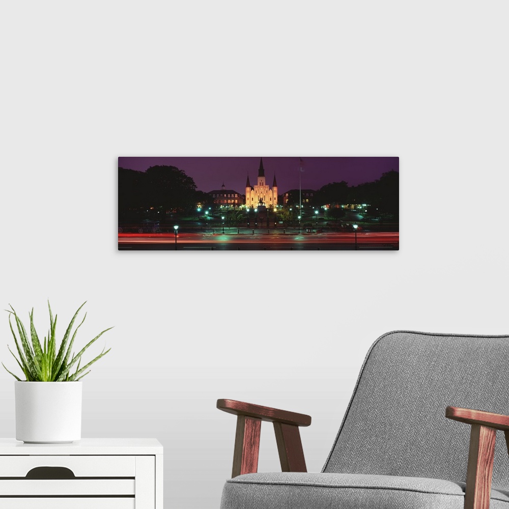 A modern room featuring This is a time lapsed photograph of a historic building on a panoramic canvas.