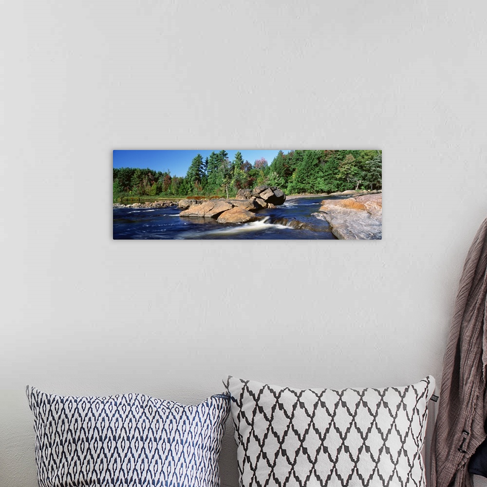 A bohemian room featuring New York, Adirondack State Park, Moose River, River flowing through the forest