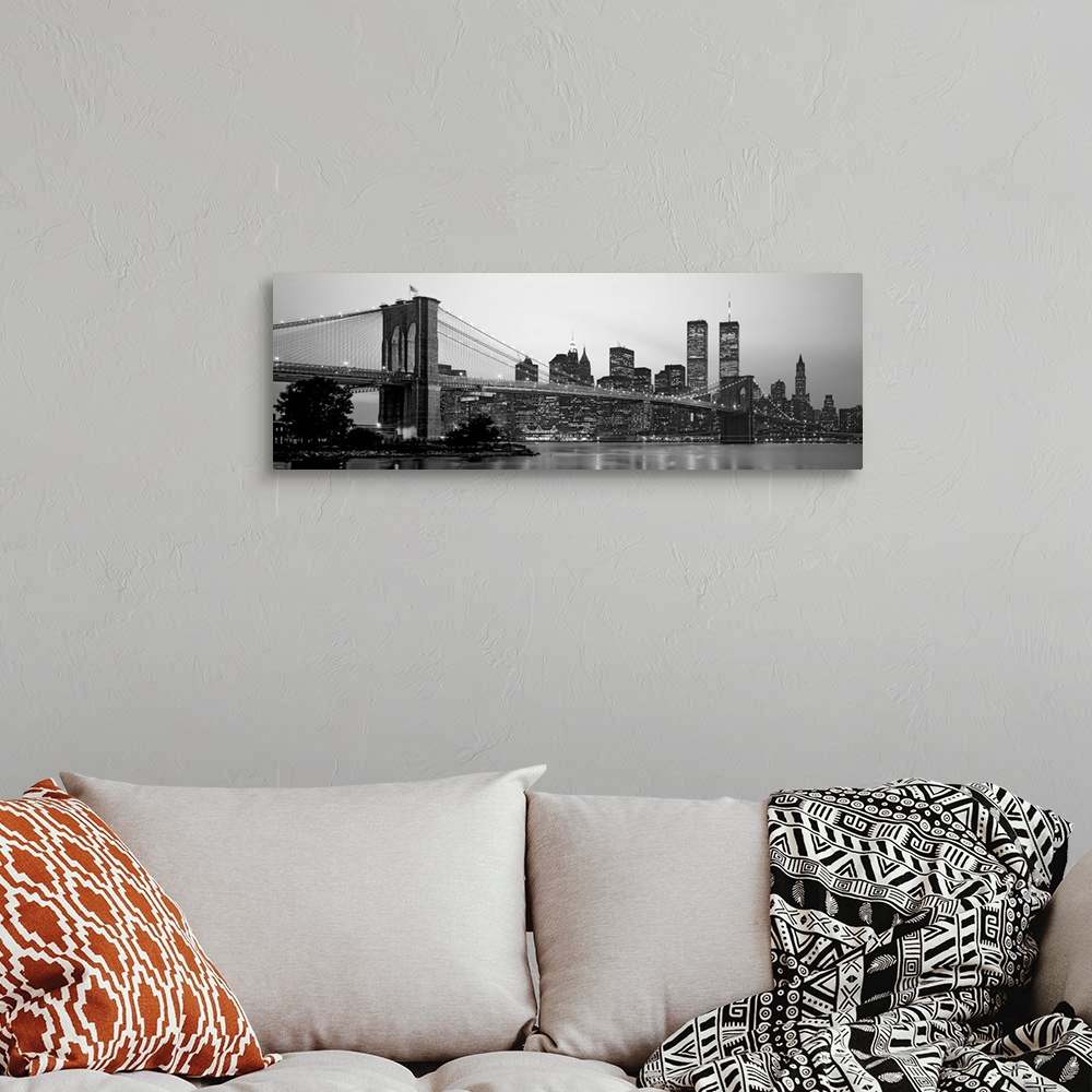 A bohemian room featuring Panoramic photograph of the Brooklyn Bridge against a skyline filled with skyscrapers in New York...