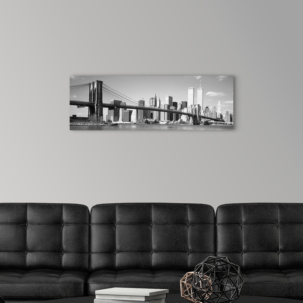 A modern room featuring Taken from the water on a sunny day this panoramic photograph shows the entire bridge and most of...