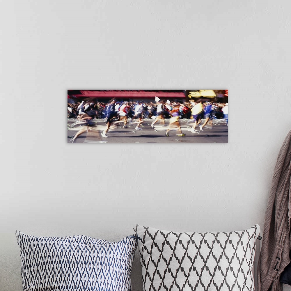 A bohemian room featuring This panoramic shot is taken of runners in motion during a marathon so everyone appears blurry.