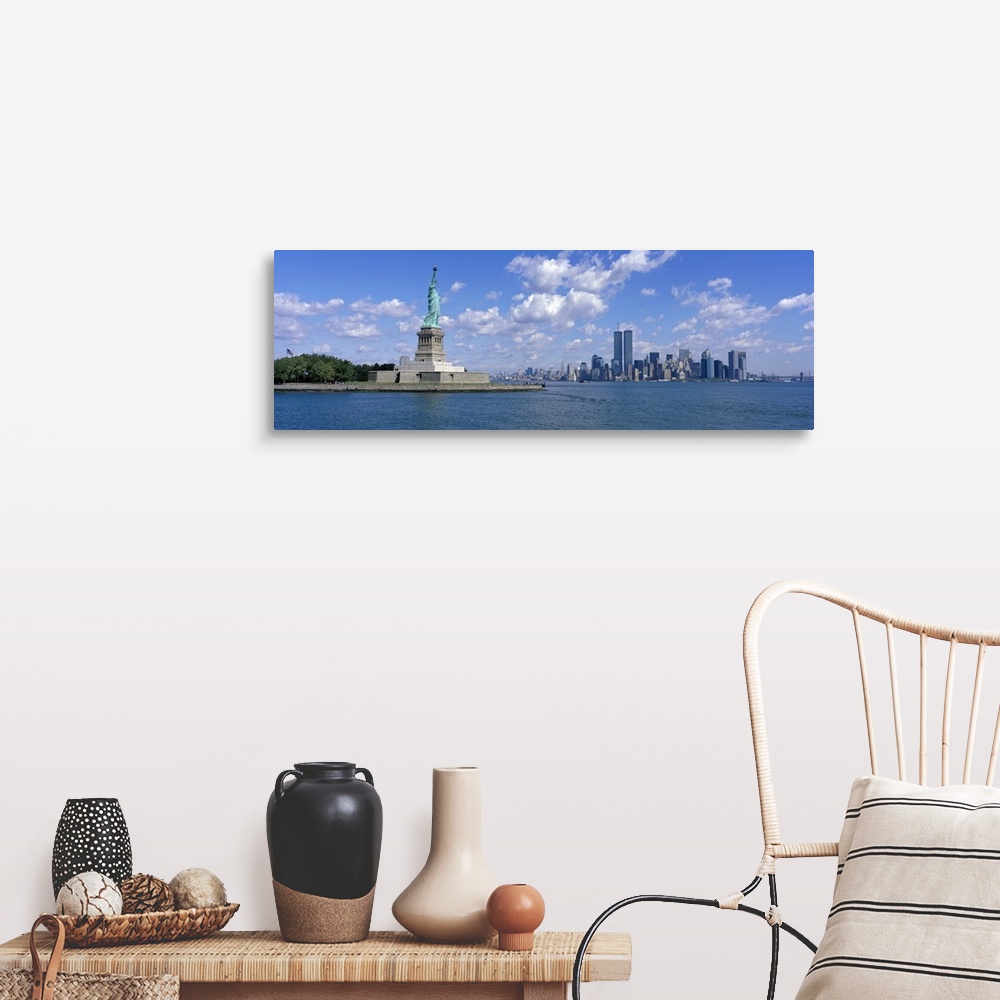 A farmhouse room featuring Panoramic picture taken from a distance of the NYC skyline with Ellis Island and the Statue of Li...