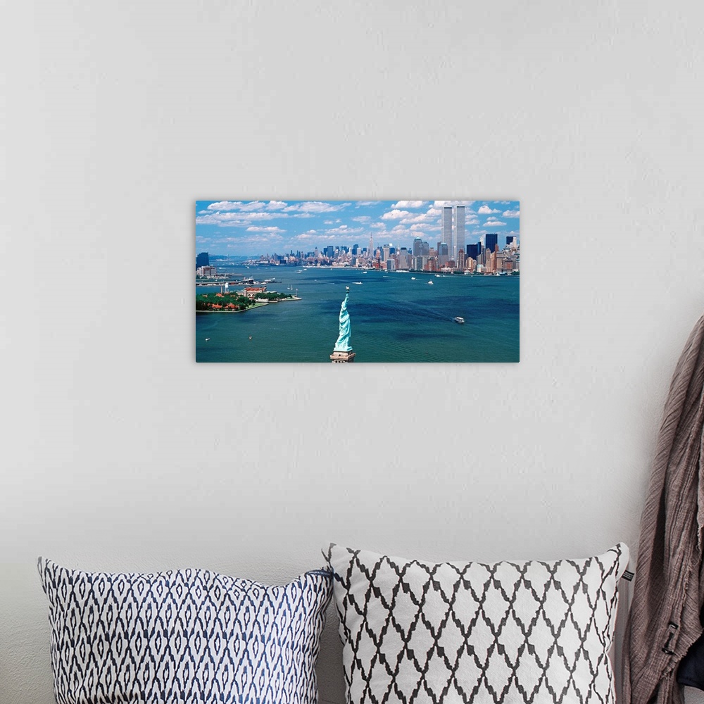 A bohemian room featuring Panoramic wall art of Manhattan, Ellis Isle, and Hudson River photographed from south of the Stat...