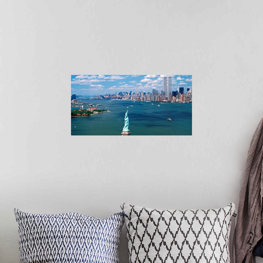A bohemian room featuring Panoramic wall art of Manhattan, Ellis Isle, and Hudson River photographed from south of the Stat...