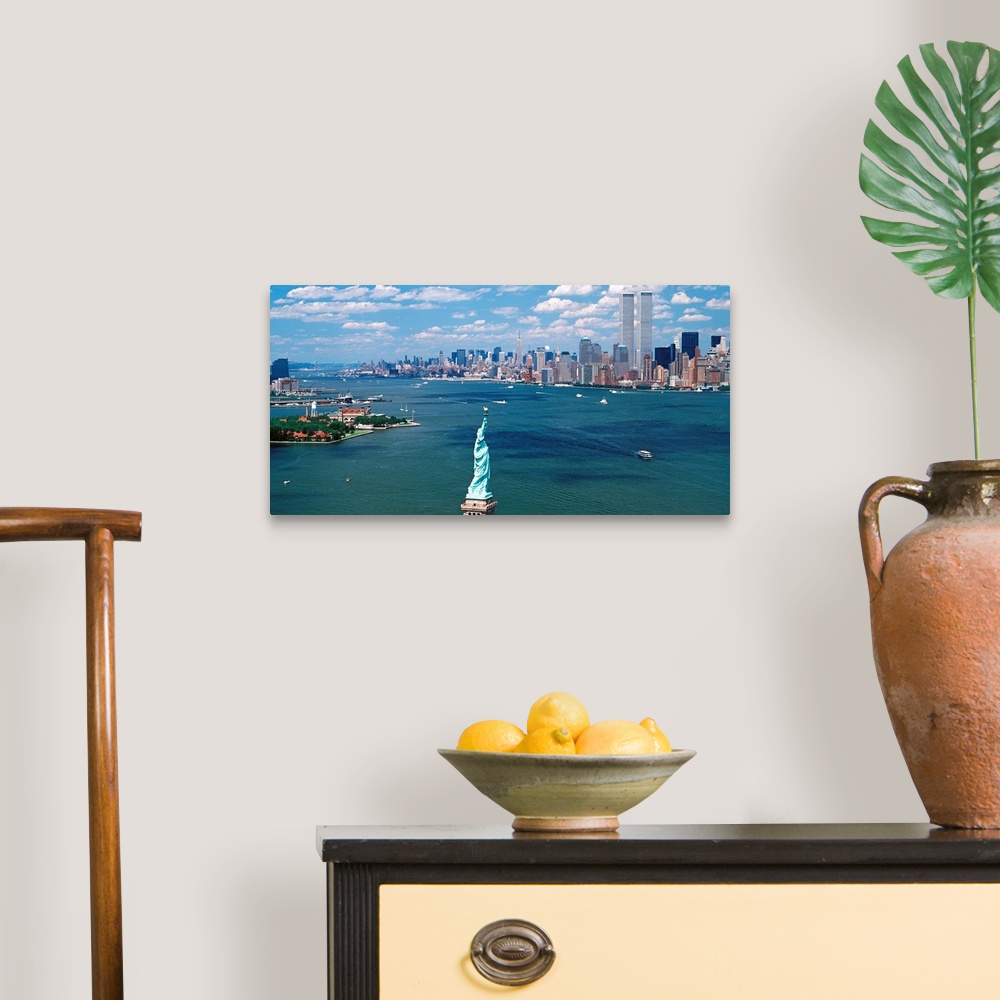 A traditional room featuring Panoramic wall art of Manhattan, Ellis Isle, and Hudson River photographed from south of the Stat...