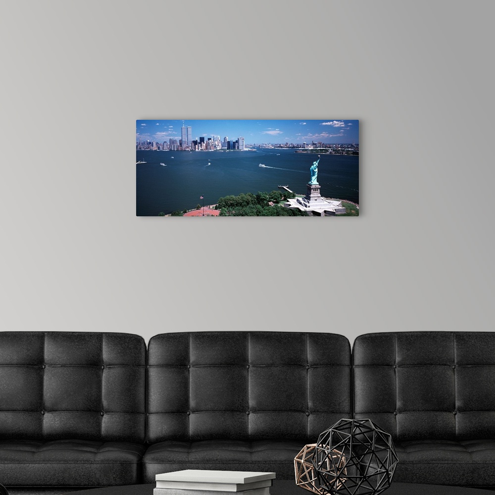 A modern room featuring Big, horizontal photograph of the Statue of Liberty and the New York Harbor.  The New York City s...