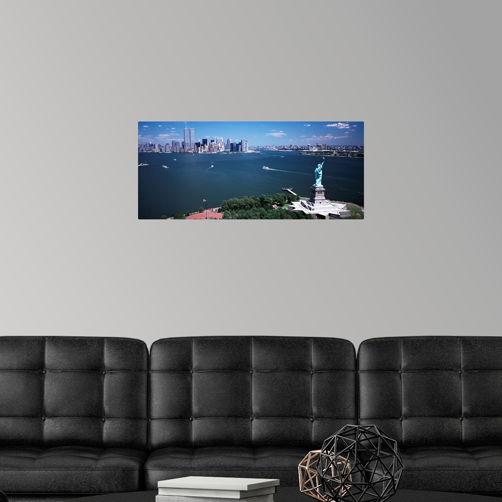 A modern room featuring Big, horizontal photograph of the Statue of Liberty and the New York Harbor.  The New York City s...