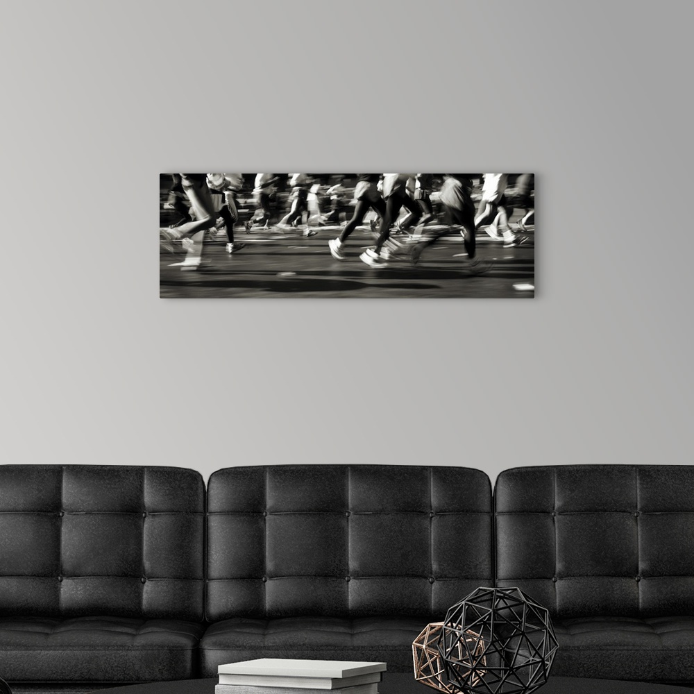 A modern room featuring Large, horizontal photograph of many runners from their waists down, running in a blur in the New...