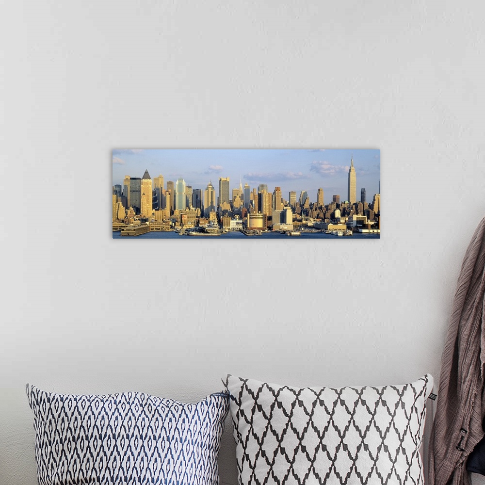 A bohemian room featuring Panoramic photograph shows the daytime skyline of a busy city within the Northeastern United Stat...