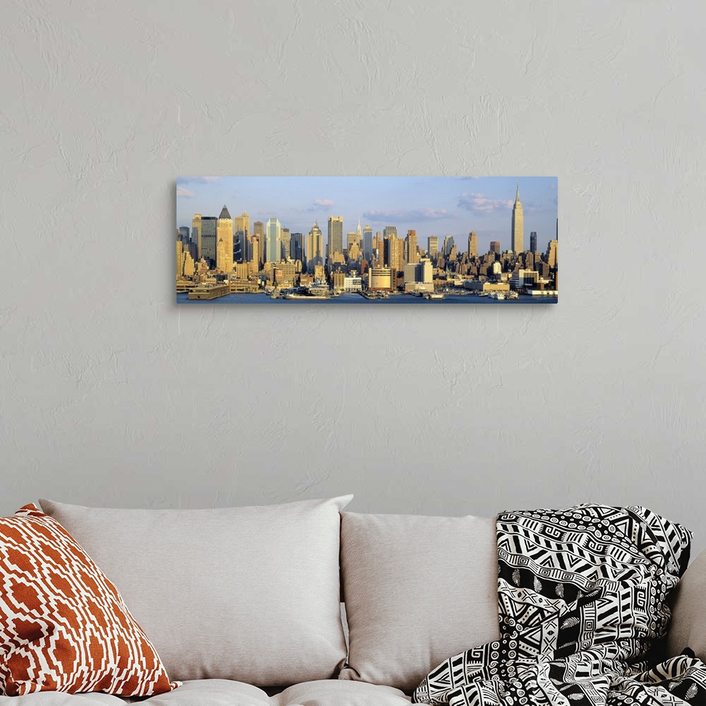 A bohemian room featuring Panoramic photograph shows the daytime skyline of a busy city within the Northeastern United Stat...