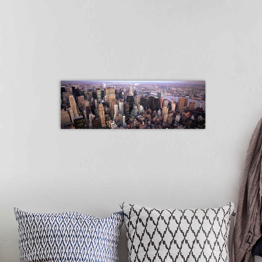 A bohemian room featuring Wide angle, aerial photograph of  the New York City skyline.