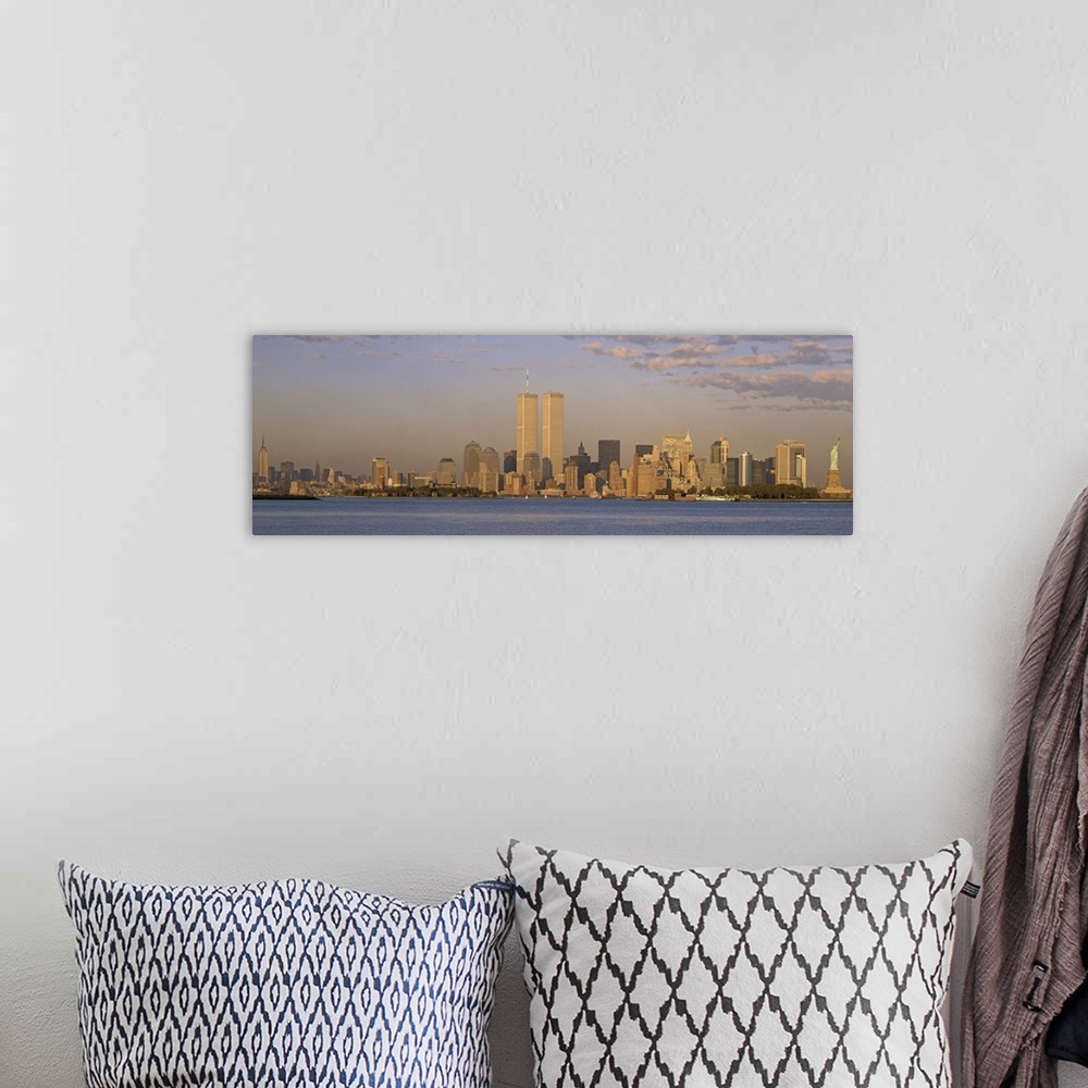 A bohemian room featuring Panoramic image of the NYC skyline with the Twin Towers at sunset.