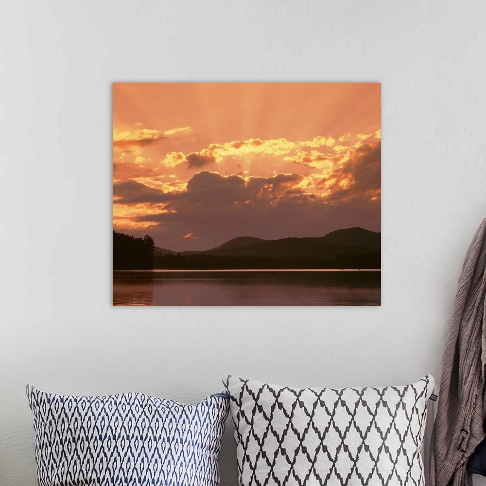 A bohemian room featuring New York State, Adirondack Mountains, Rollins Pond, Sunlight and moody sky over the mountain and ...