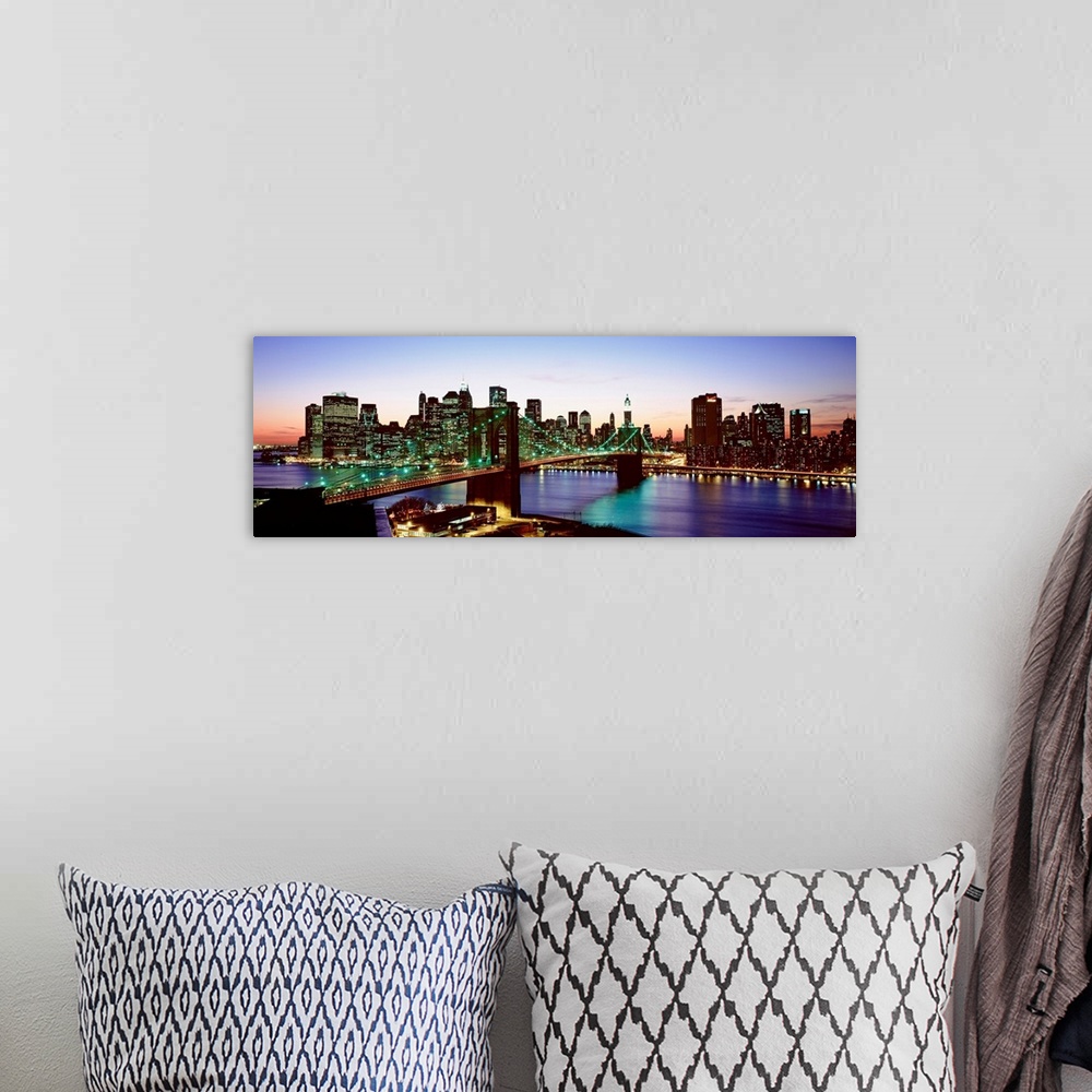 A bohemian room featuring This panoramic photograph shows the entire Brooklyn Bridge and the bottom of the island of Manhat...