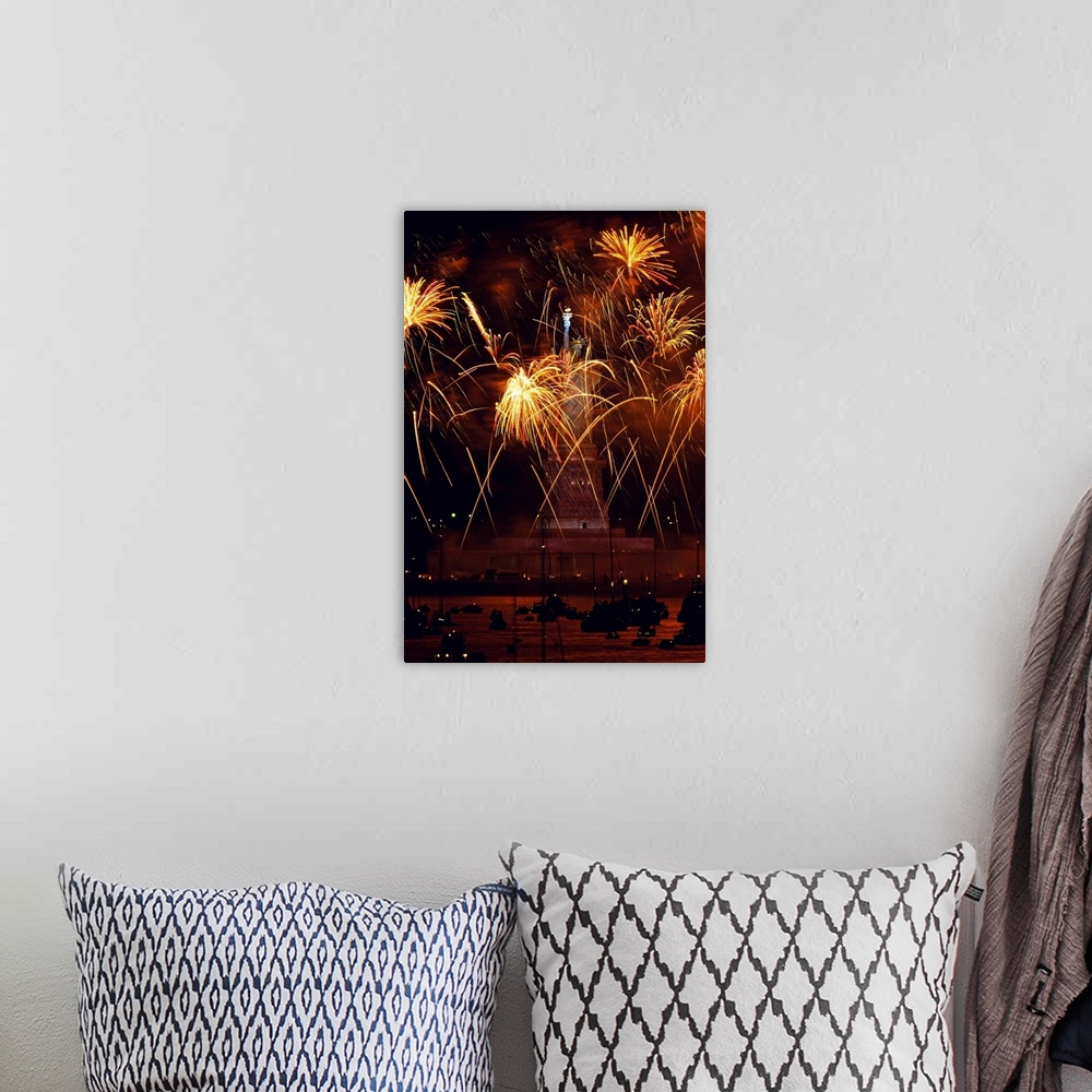 A bohemian room featuring Vertical, oversized photograph of fireworks exploding in front of the Statue of Liberty, as many ...