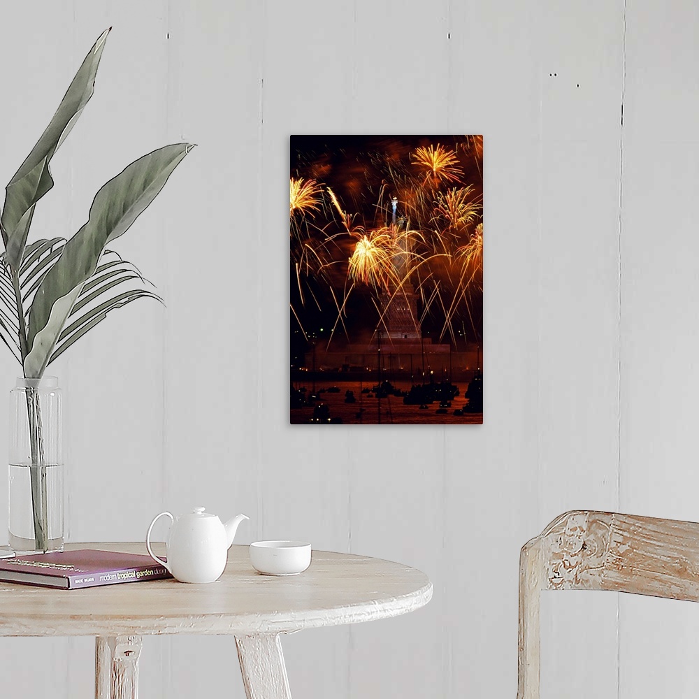 A farmhouse room featuring Vertical, oversized photograph of fireworks exploding in front of the Statue of Liberty, as many ...