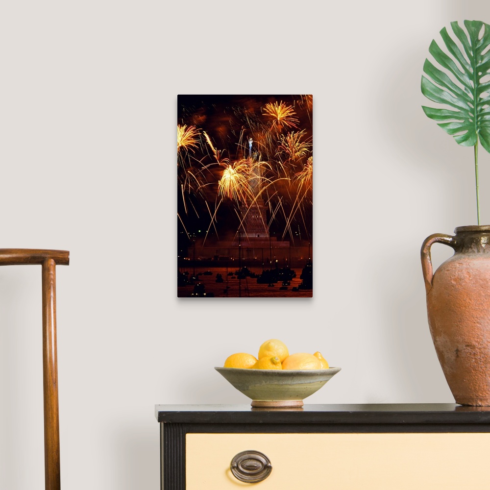 A traditional room featuring Vertical, oversized photograph of fireworks exploding in front of the Statue of Liberty, as many ...