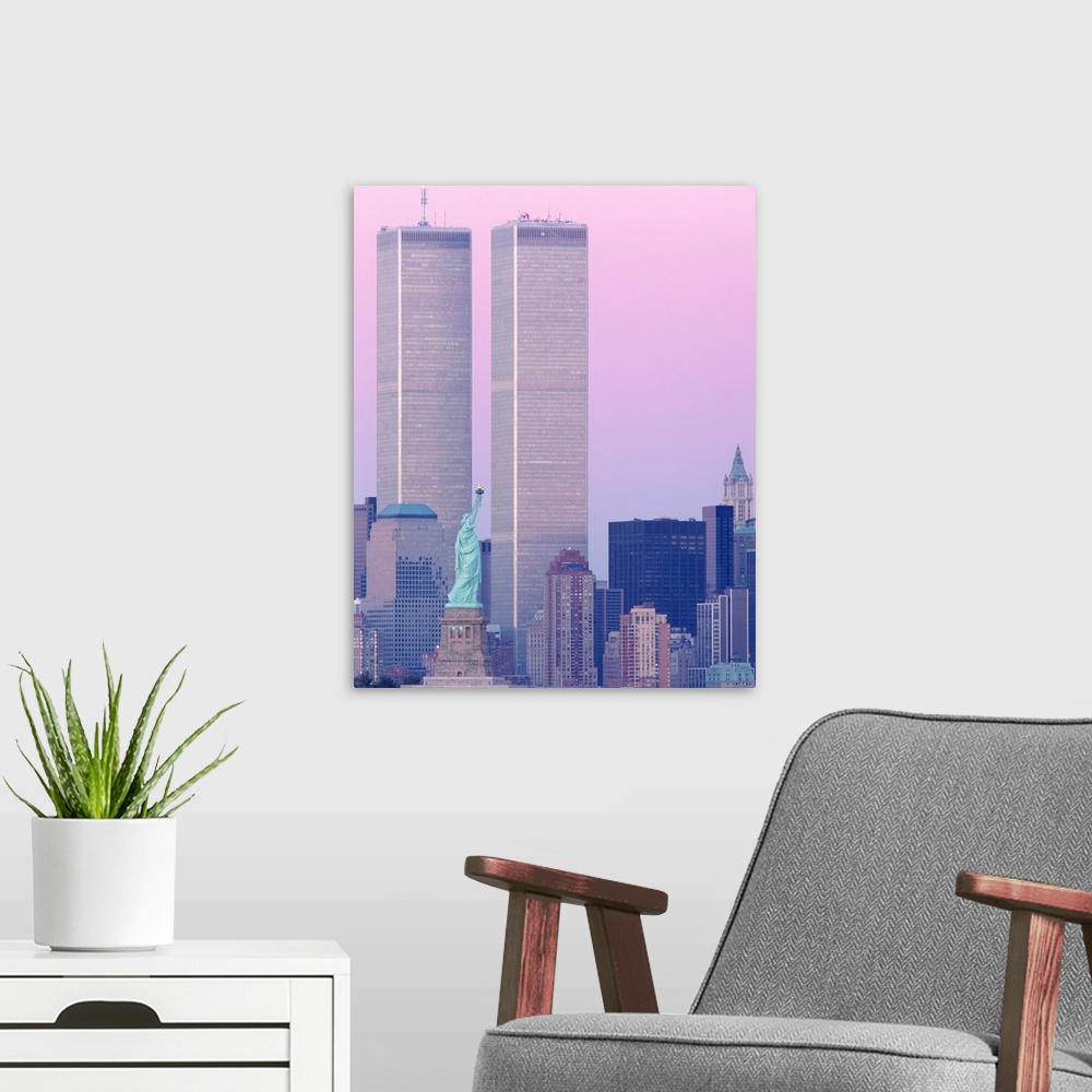 A modern room featuring Big, vertical photograph of New York City, including the Statue of Liberty and the World Trade Ce...