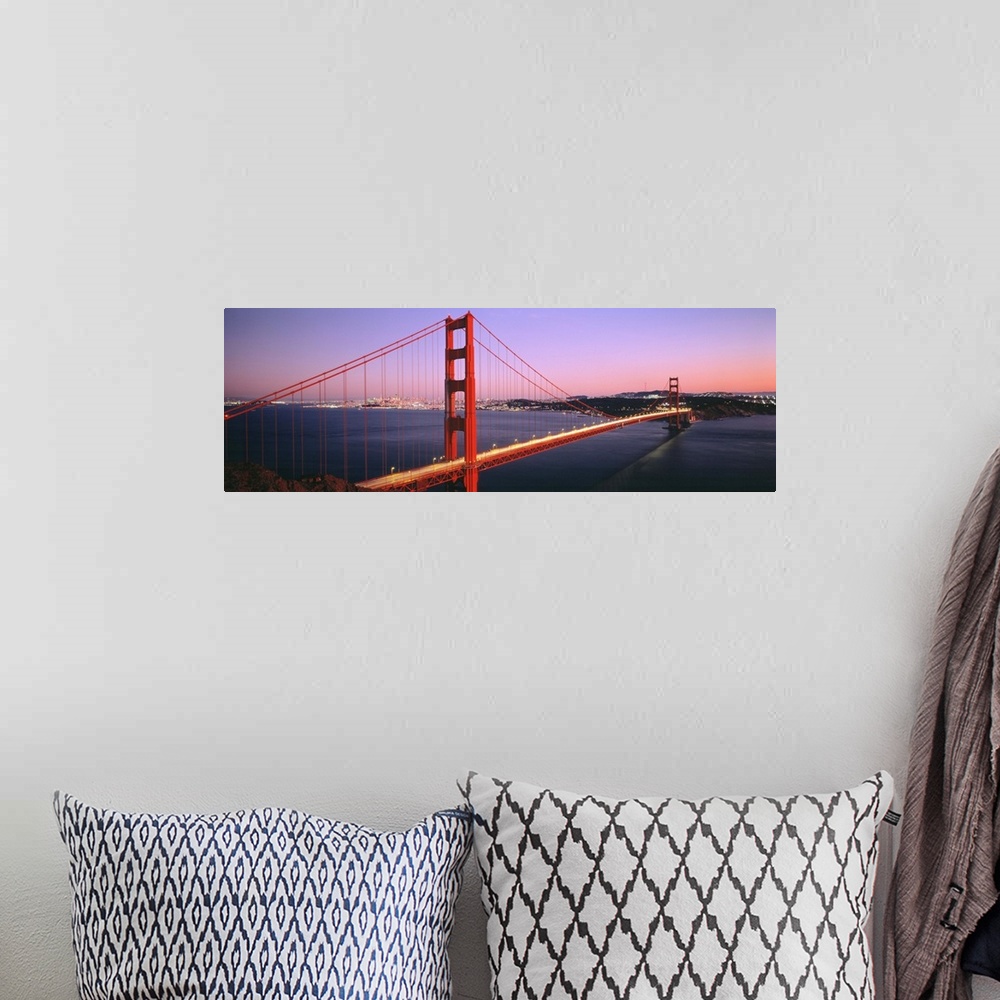 A bohemian room featuring Panoramic photograph includes a landmark bridge spanning a large body of water in California.  Th...