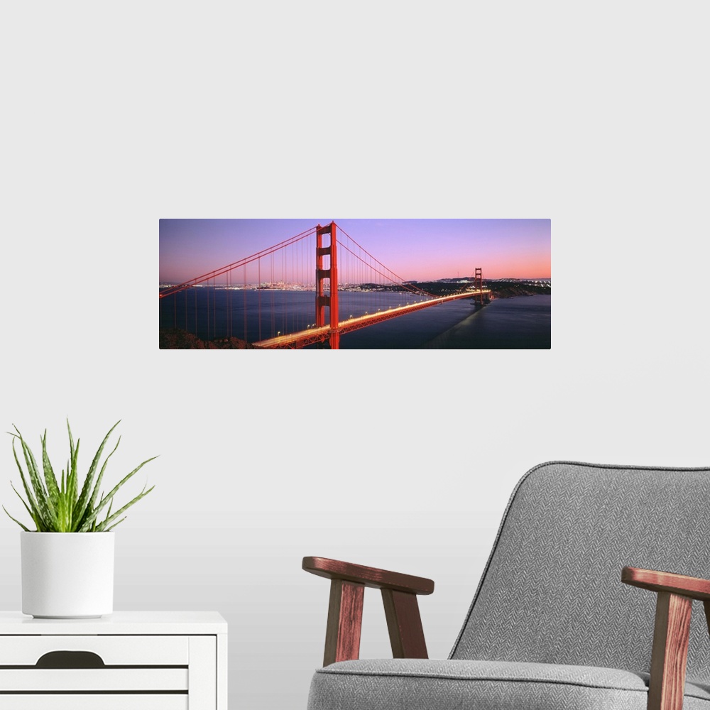 A modern room featuring Panoramic photograph includes a landmark bridge spanning a large body of water in California.  Th...