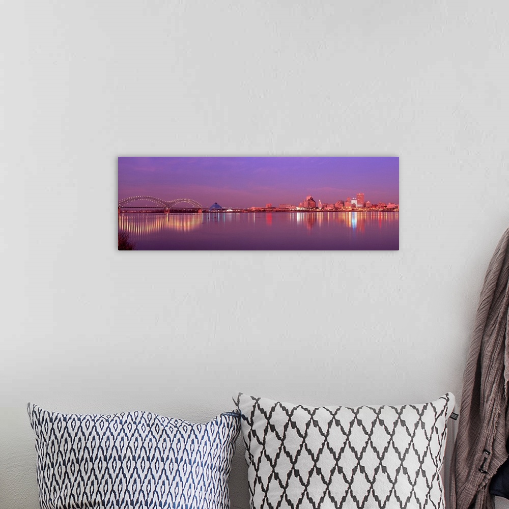 A bohemian room featuring This photographic wall art a panoramic cityscape of Memphis lights reflecting on the Mississippi ...