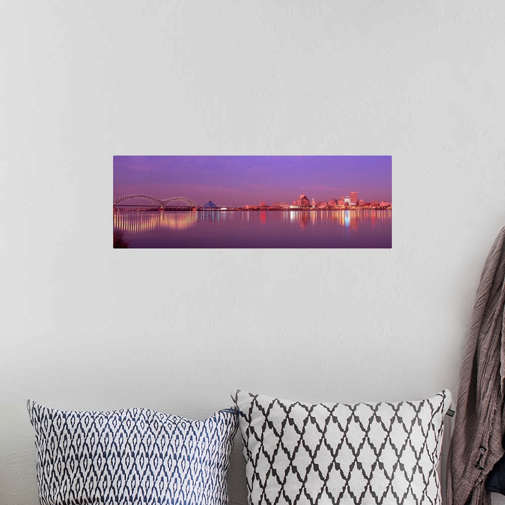 A bohemian room featuring This photographic wall art a panoramic cityscape of Memphis lights reflecting on the Mississippi ...