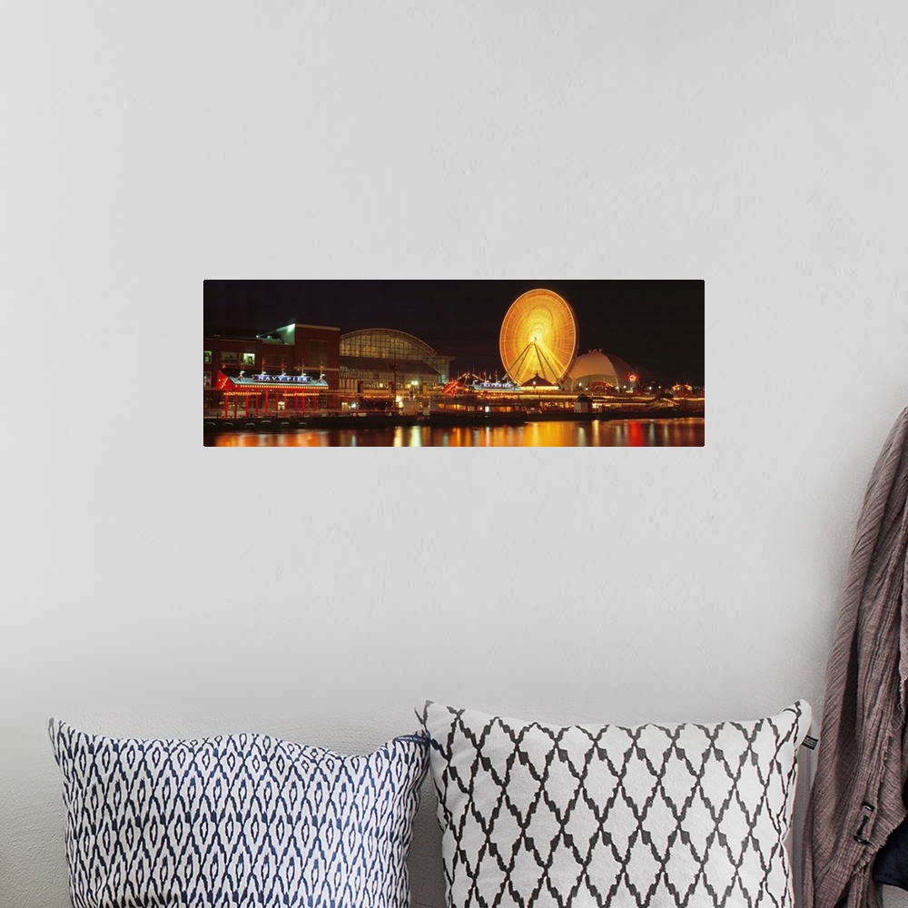 A bohemian room featuring Panoramic photo on canvas of the navy pier lit up at night along a waterfront with a ferris wheel.
