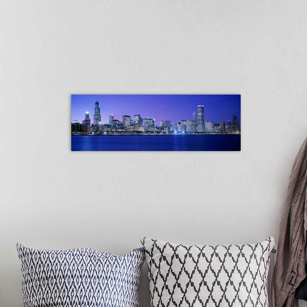 A bohemian room featuring Panoramic photograph displays the lively skyline of this landmark city located within the Midwest...