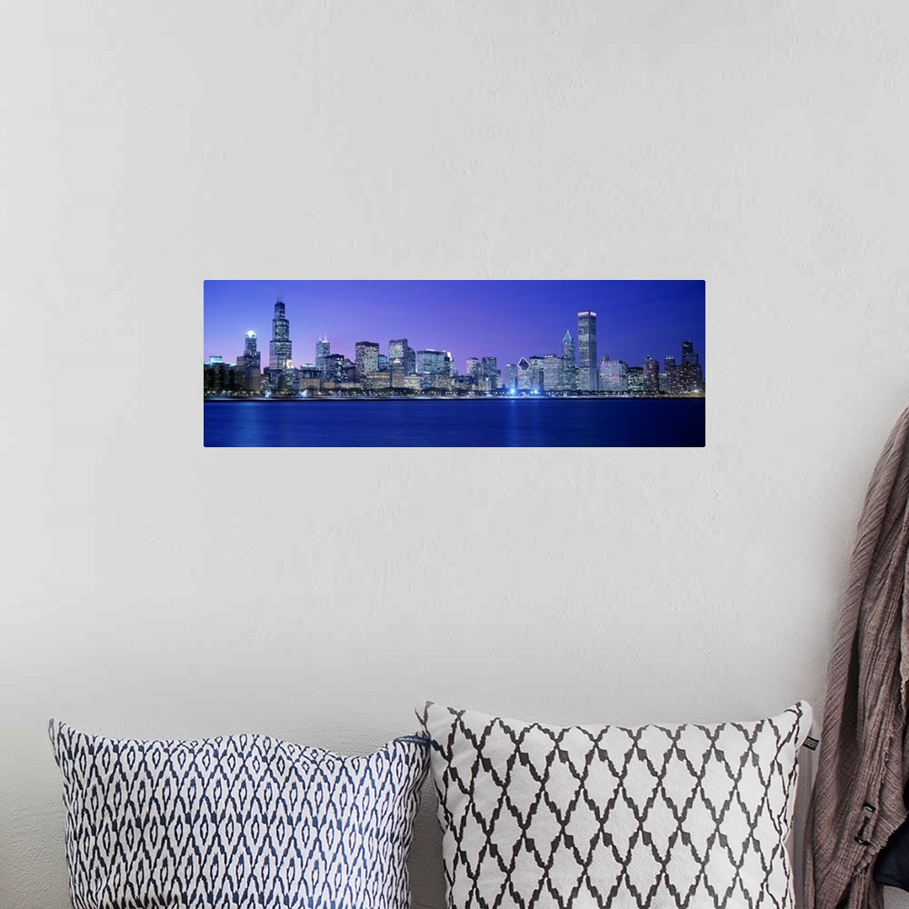 A bohemian room featuring Panoramic photograph displays the lively skyline of this landmark city located within the Midwest...
