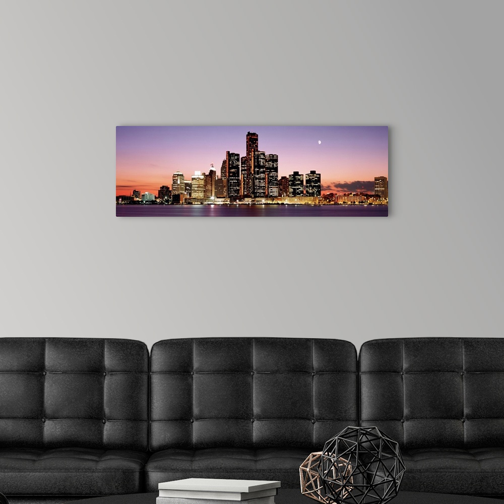 A modern room featuring Panoramic skyline of downtown Detroit at sundown.