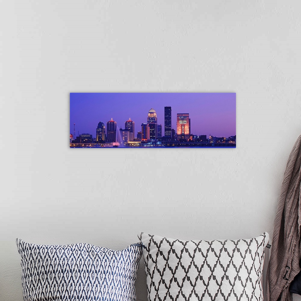 A bohemian room featuring Panoramic photo on canvas of a cityscape in Kentucky lit up at night along a waterfront.