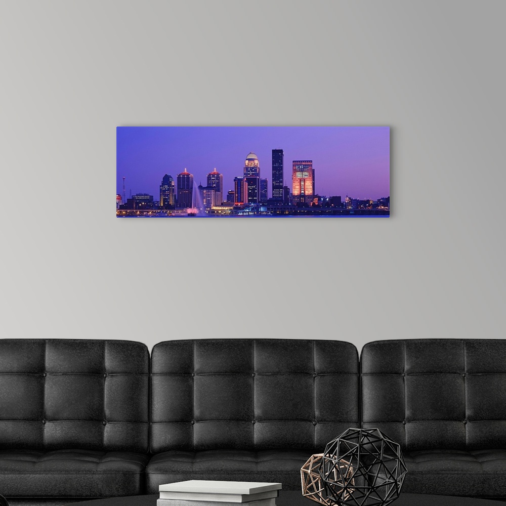 A modern room featuring Panoramic photo on canvas of a cityscape in Kentucky lit up at night along a waterfront.