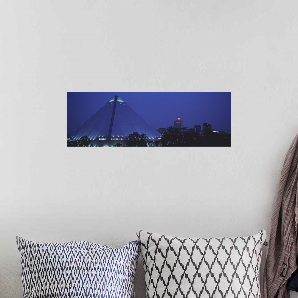 A bohemian room featuring A panorama of the Pyramid Arena at night. The 32-story Memphis Pyramid is 3rd largest in the worl...