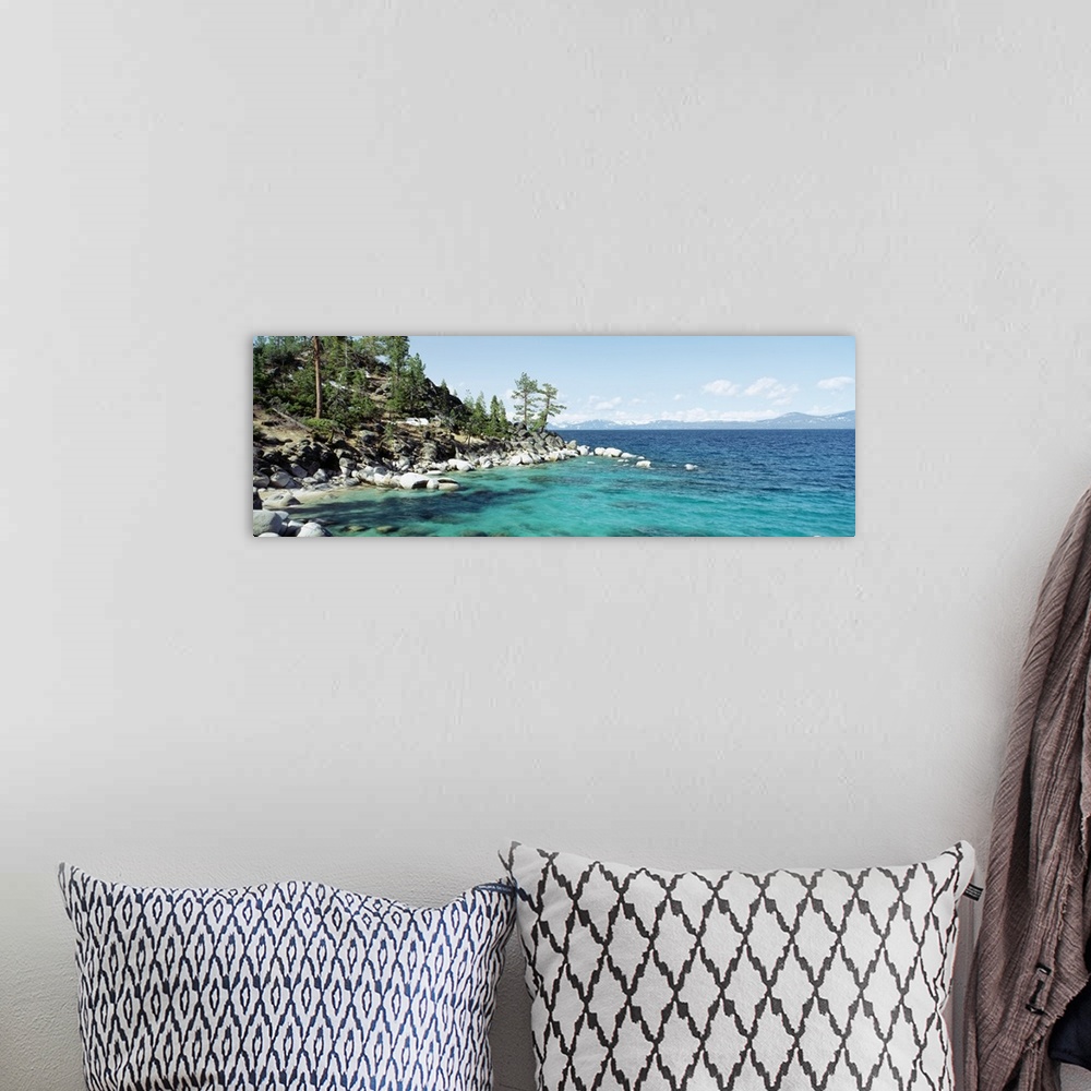 A bohemian room featuring Panoramic photograph on a large wall hanging of the rocky North Shore of Lake Tahoe, the hillside...