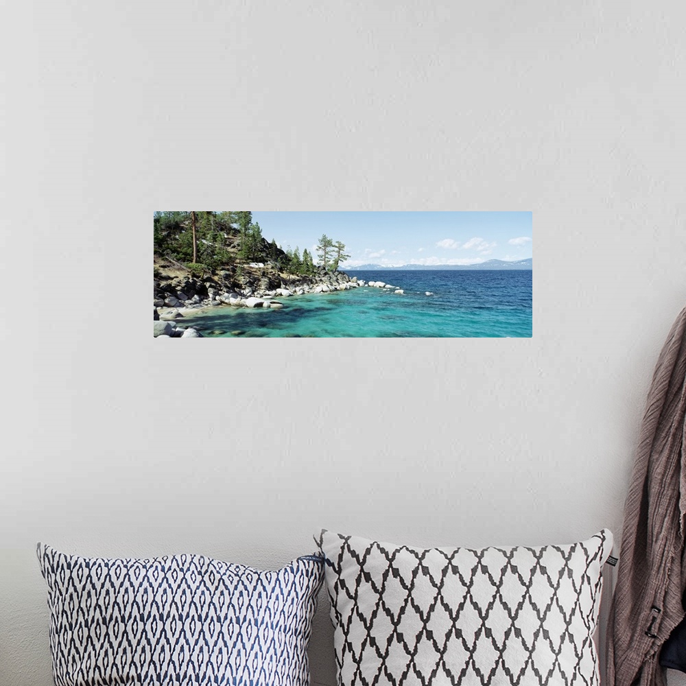 A bohemian room featuring Panoramic photograph on a large wall hanging of the rocky North Shore of Lake Tahoe, the hillside...