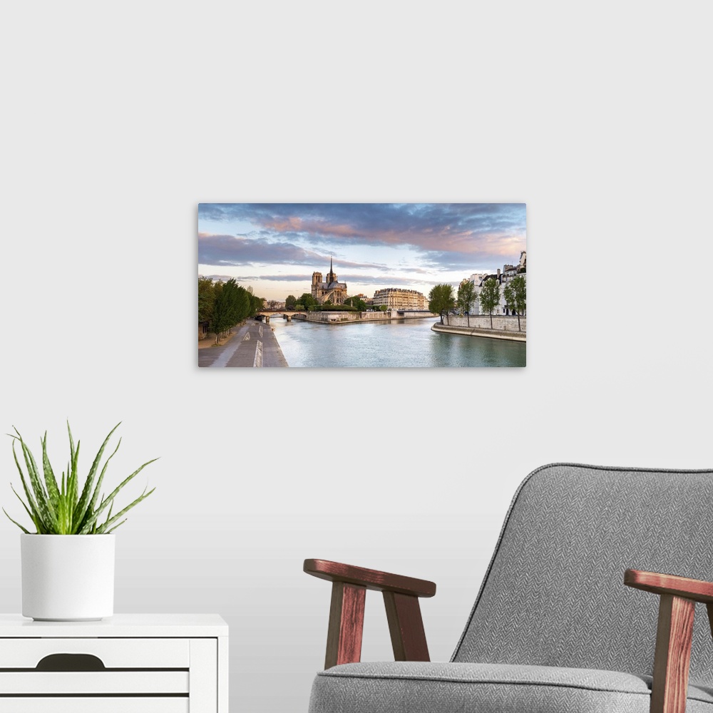 A modern room featuring Notre Dame Cathedral on the banks of the Seine River at sunrise, Paris, Ile-de-France, France