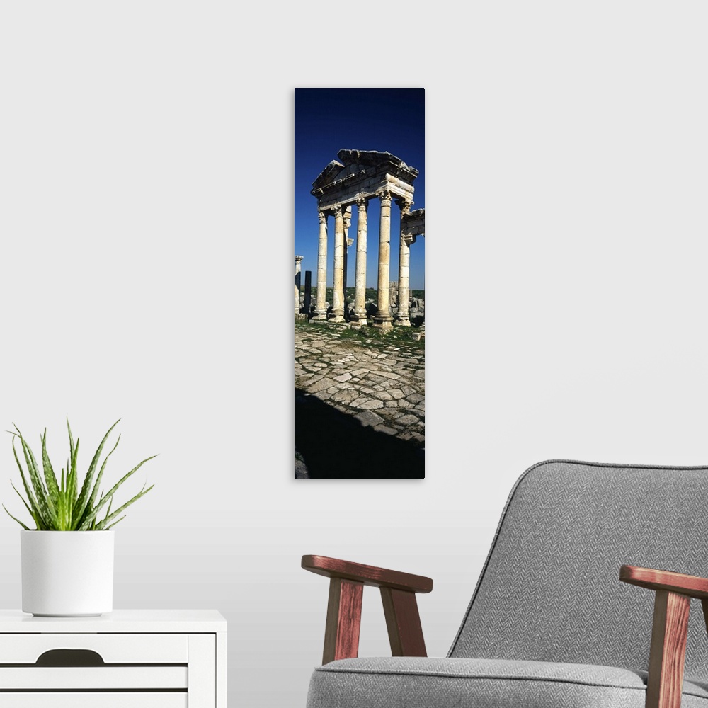 A modern room featuring Old ruins of a built structure, Entrance Columns, Apamea, Syria