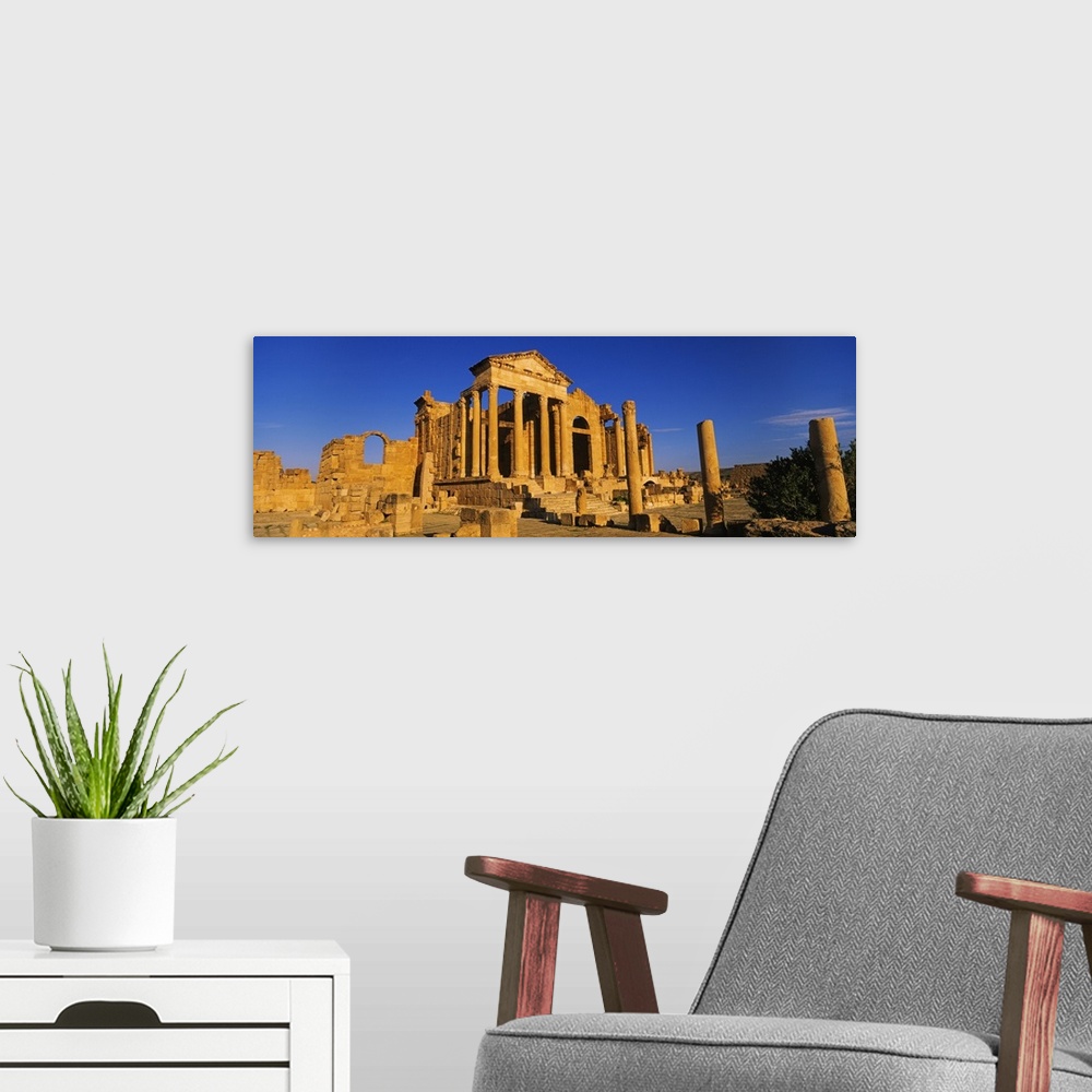 A modern room featuring Old ruins of buildings in a city, Sbeitla, Kairwan, Tunisia