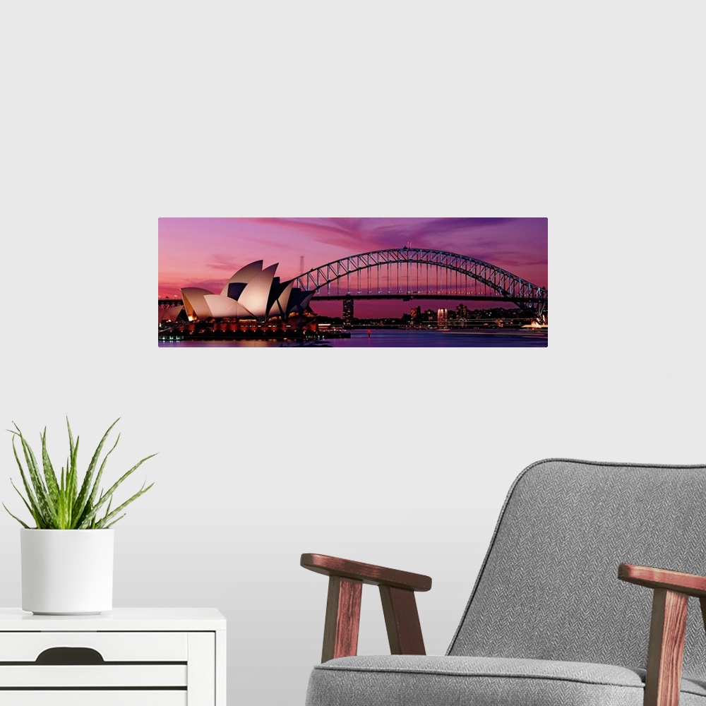 A modern room featuring Panoramic photograph of iconic floating building structure with bridge and city skyline in distan...