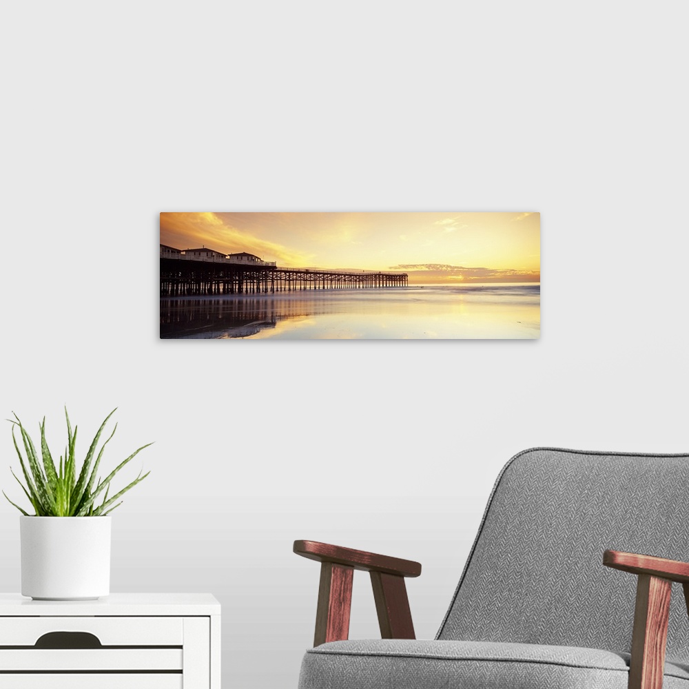 A modern room featuring Sunset ovr Pacific Ocean CA USA