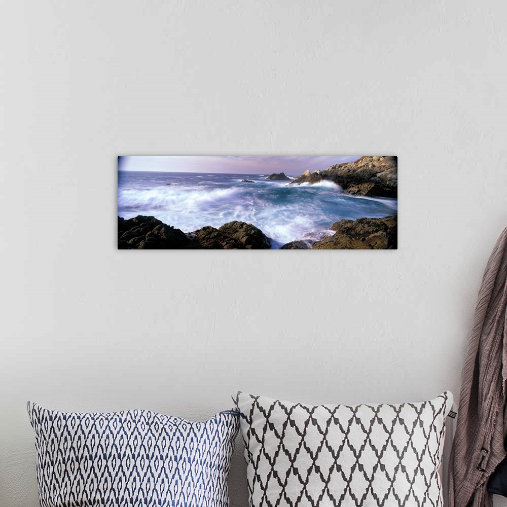 A bohemian room featuring Panoramic photograph on a large canvas of ocean waves crashing into the rocks near San Simeon Poi...