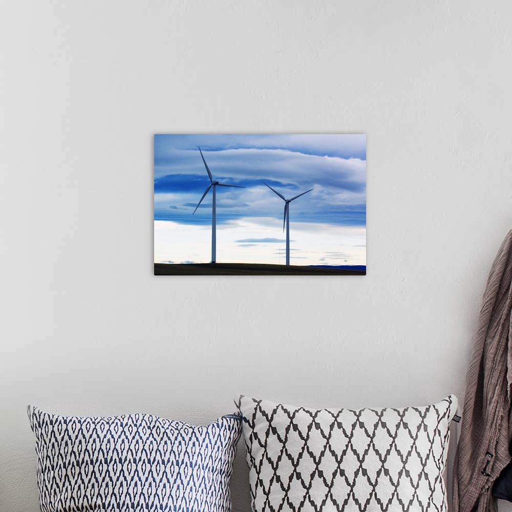 A bohemian room featuring Pair of wind farm turbines, cloudy sky, Montana