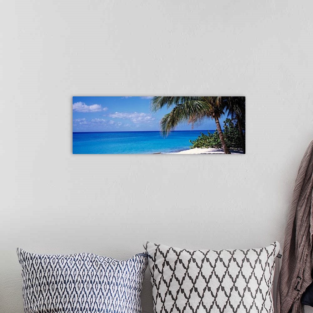 A bohemian room featuring Wall art for the home or office this panoramic photograph captures a still sea with minimal cloud...