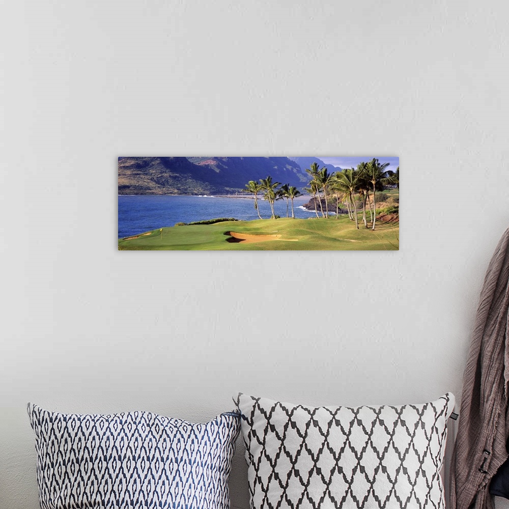 A bohemian room featuring View of the sea from the 13th Hole at the Kauai Lagoons Golf Club in Lihue, Hawaii.