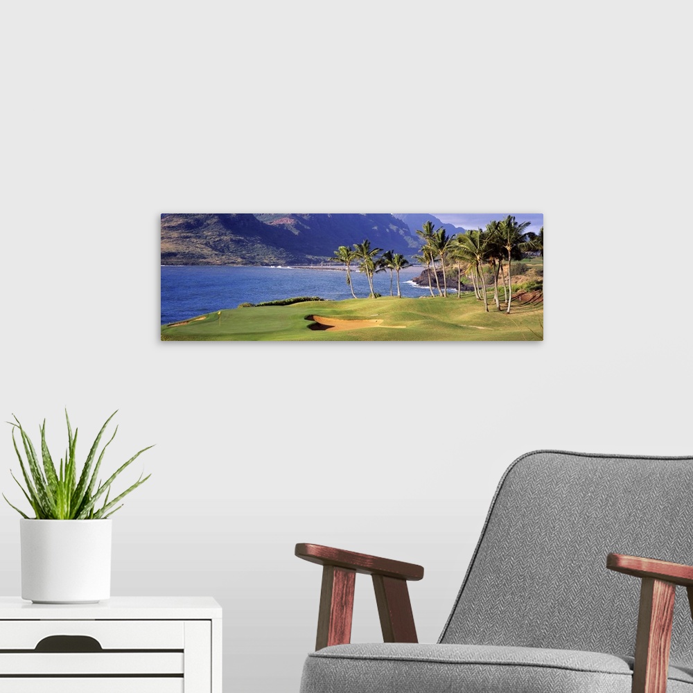 A modern room featuring View of the sea from the 13th Hole at the Kauai Lagoons Golf Club in Lihue, Hawaii.
