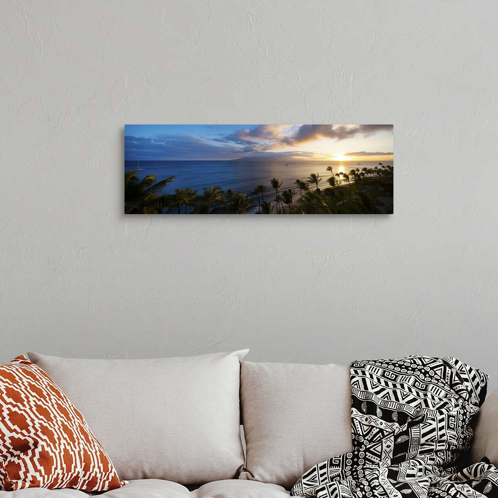 A bohemian room featuring Palm trees on the beach at dusk, Kaanapali, Maui, Hawaii, USA.